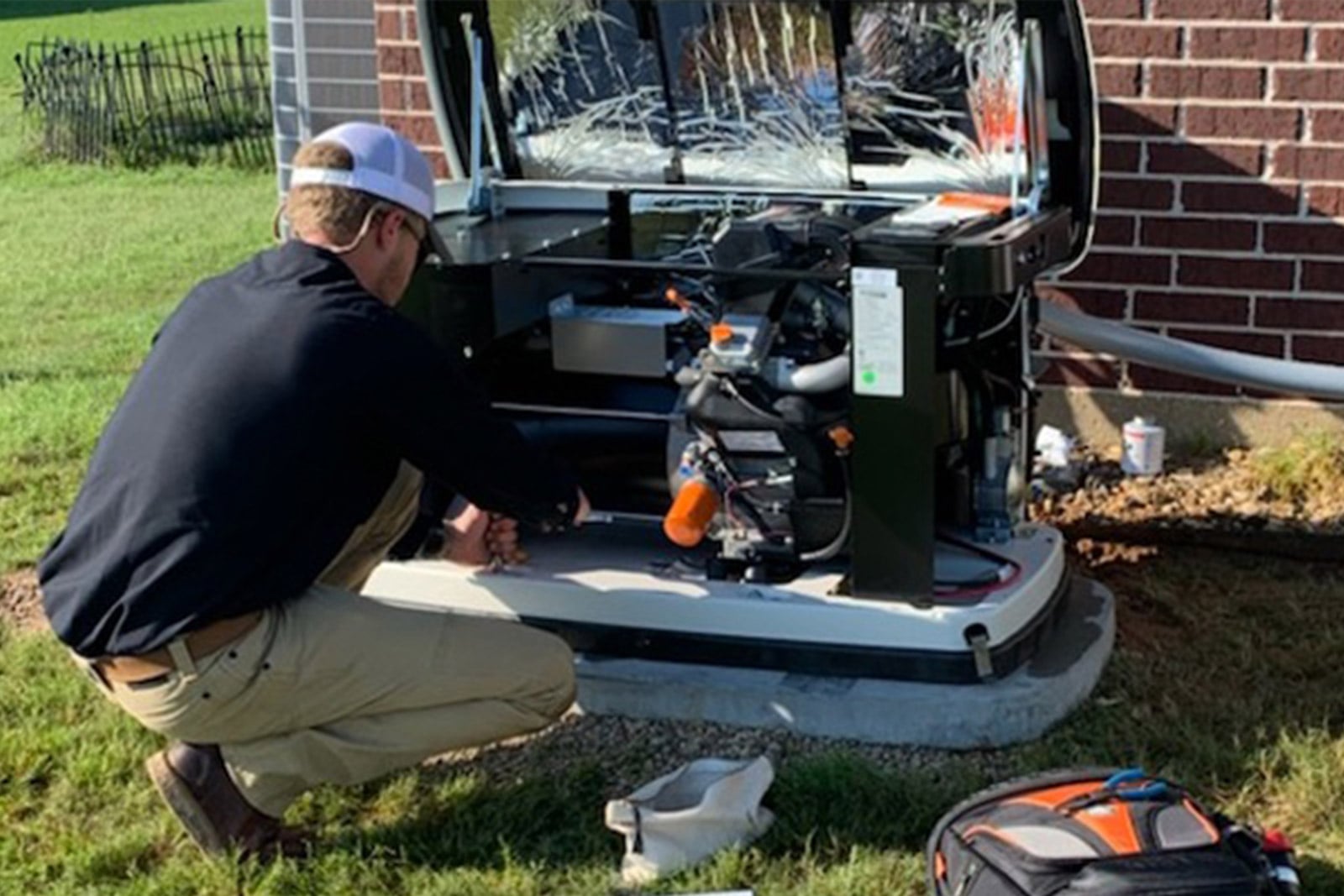 electrician fixing an AC unit